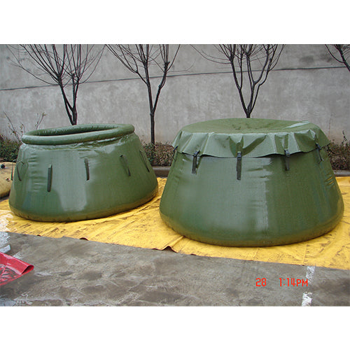 Two green inflatable water storage bladders, one covered with a protective tarp, placed on a yellow surface outdoors, ideal for emergency water storage, military, or industrial use.