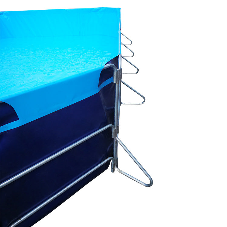 Blue portable water tanks used in a controlled industrial environment.