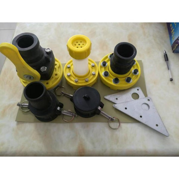 A rectangular, low-profile, light-colored flexible water storage tank (bladder) sits on dry, reddish-brown ground in a vast, arid landscape.