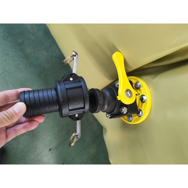 light-colored, inflated flexible water storage tanks of varying sizes sit on a concrete surface, with a truck partially visible in the background.