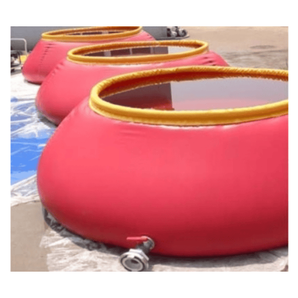 Three large, red, circular collapsible water tanks with yellow rims, partially filled with water, sit in a row on a concrete surface outdoors.